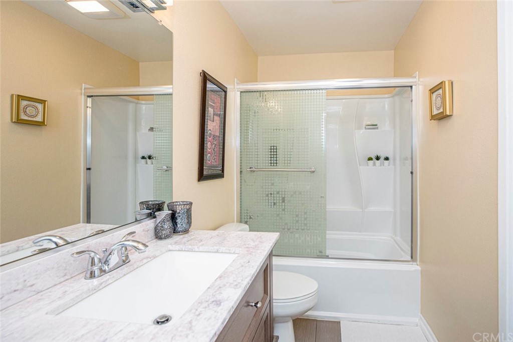 10504 Sunland Boulevard, Unit 5 Sunland, CA 91040 - Photo 27 of 66 a bathroom with a granite countertop sink toilet and shower