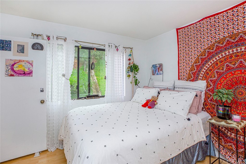 10504 Sunland Boulevard, Unit 5 Sunland, CA 91040 - Photo 29 of 66 a bedroom with a bed and a window