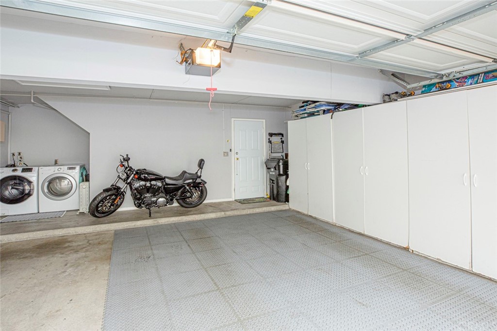 10504 Sunland Boulevard, Unit 5 Sunland, CA 91040 - Photo 36 of 66 a view of a garage with a white car parked