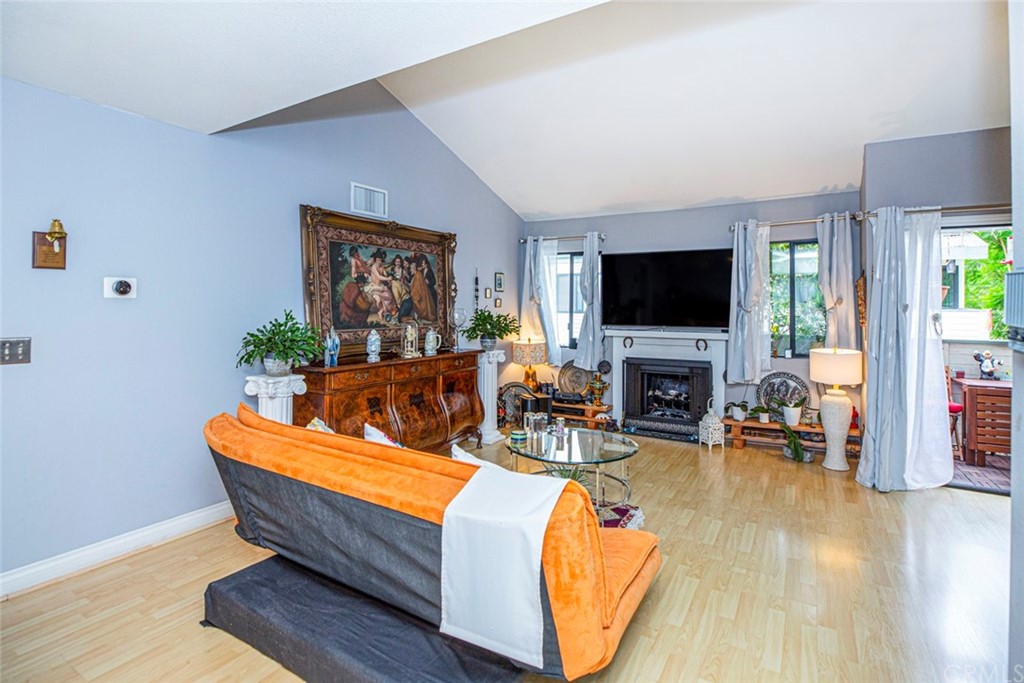 10504 Sunland Boulevard, Unit 5 Sunland, CA 91040 - Photo 8 of 66 a living room with furniture and a flat screen tv