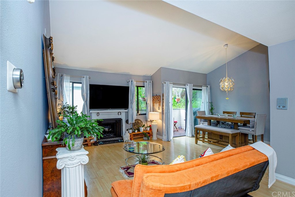 10504 Sunland Boulevard, Unit 5 Sunland, CA 91040 - Photo 9 of 66 a living room with furniture a flat screen tv and a fireplace