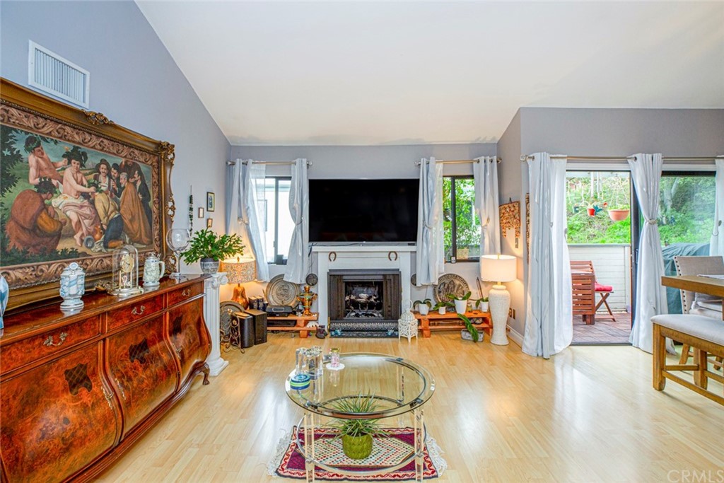 10504 Sunland Boulevard, Unit 5 Sunland, CA 91040 - Photo 10 of 66 a living room with fireplace furniture and a flat screen tv