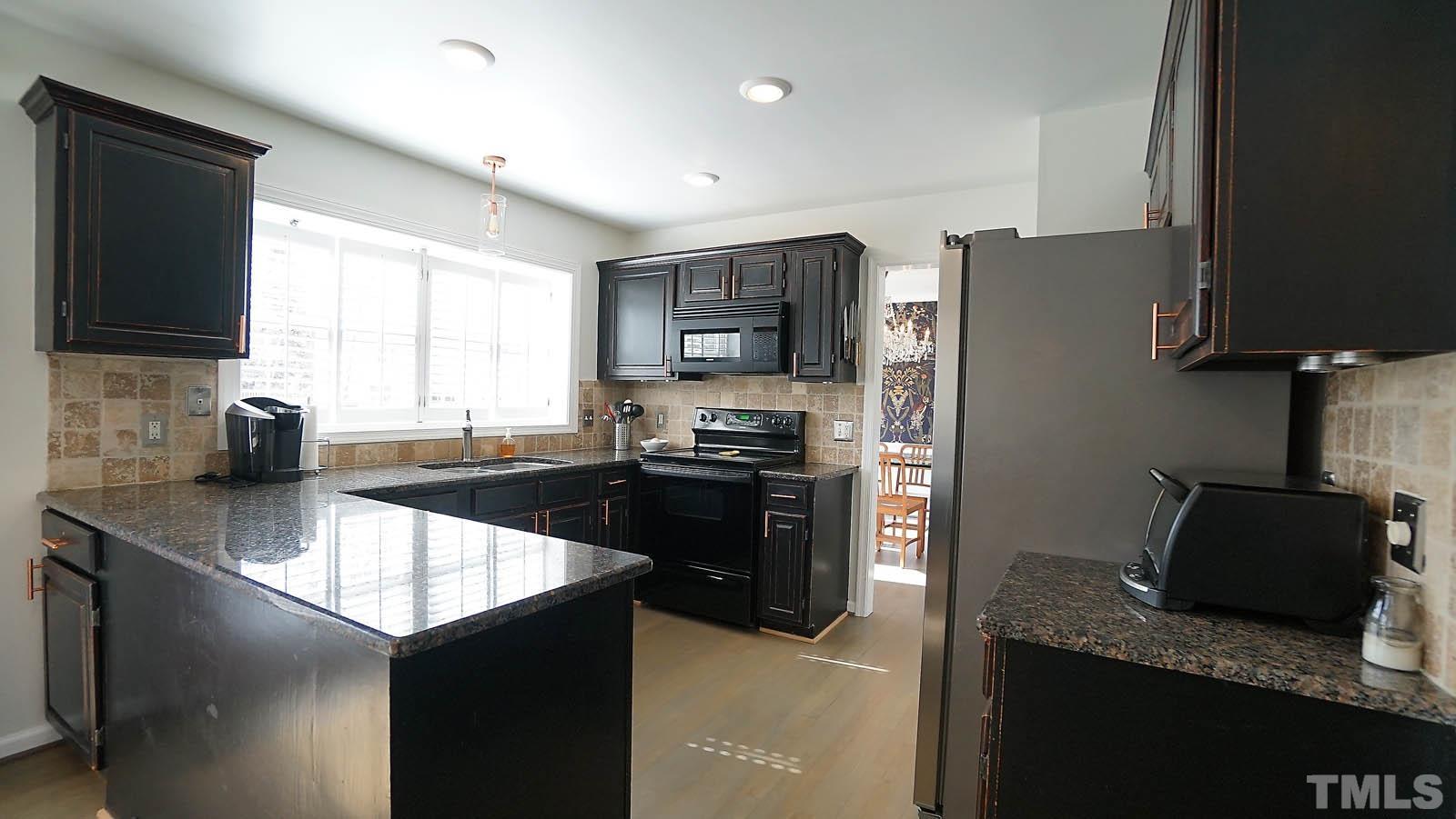 8300 Grey Abbey Place Raleigh, NC 27615 - Photo 2 of 34 Remodeled with granite counters, tile backsplash