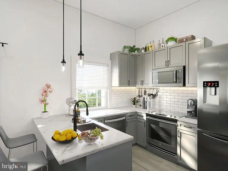 3500 Beech Avenue, Unit 3500A Baltimore, MD 21211 - Photo 2 of 7 a kitchen with refrigerator and a sink