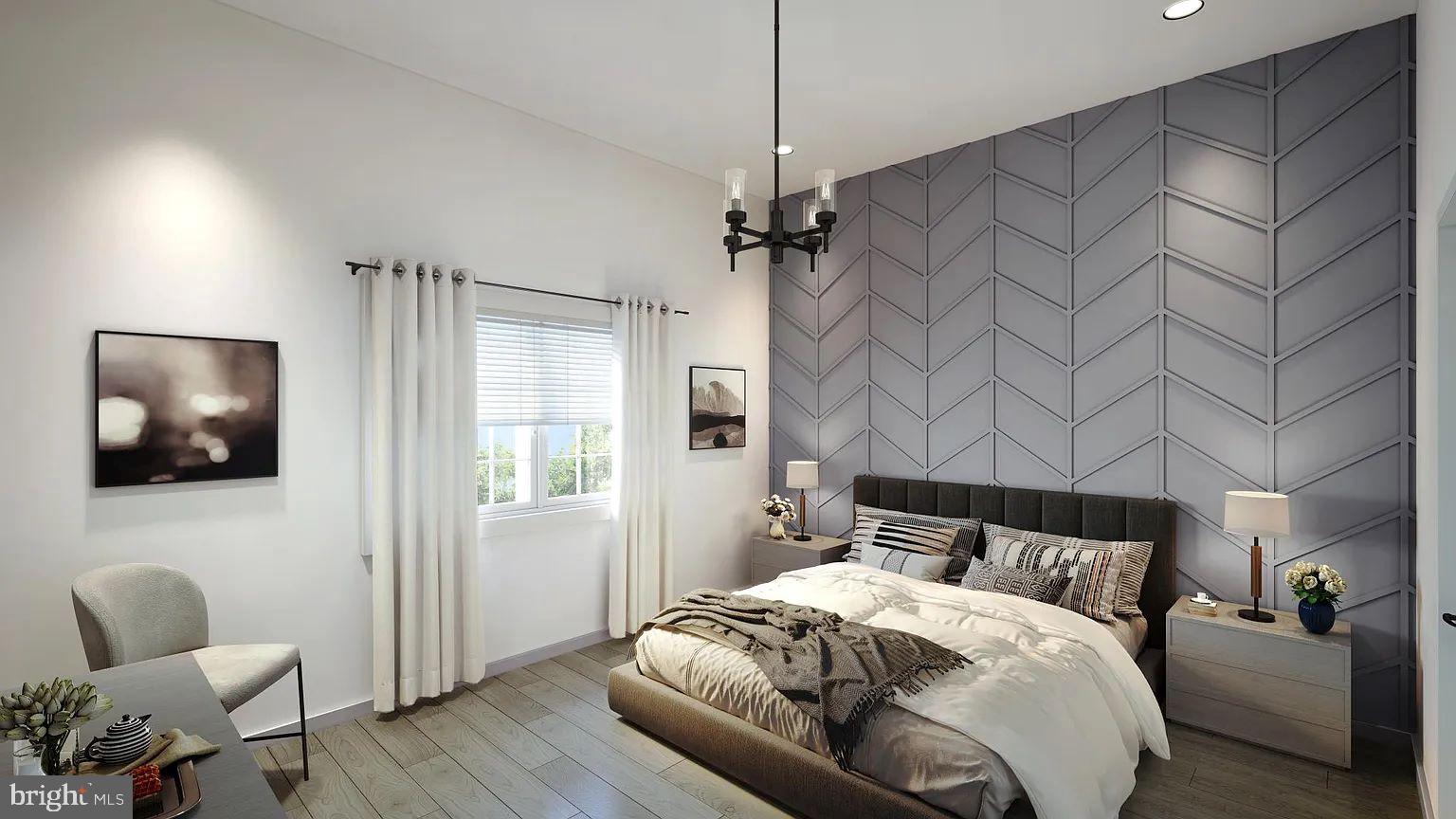 3500 Beech Avenue, Unit 3500A Baltimore, MD 21211 - Photo 4 of 7 a bedroom with a bed and a chair