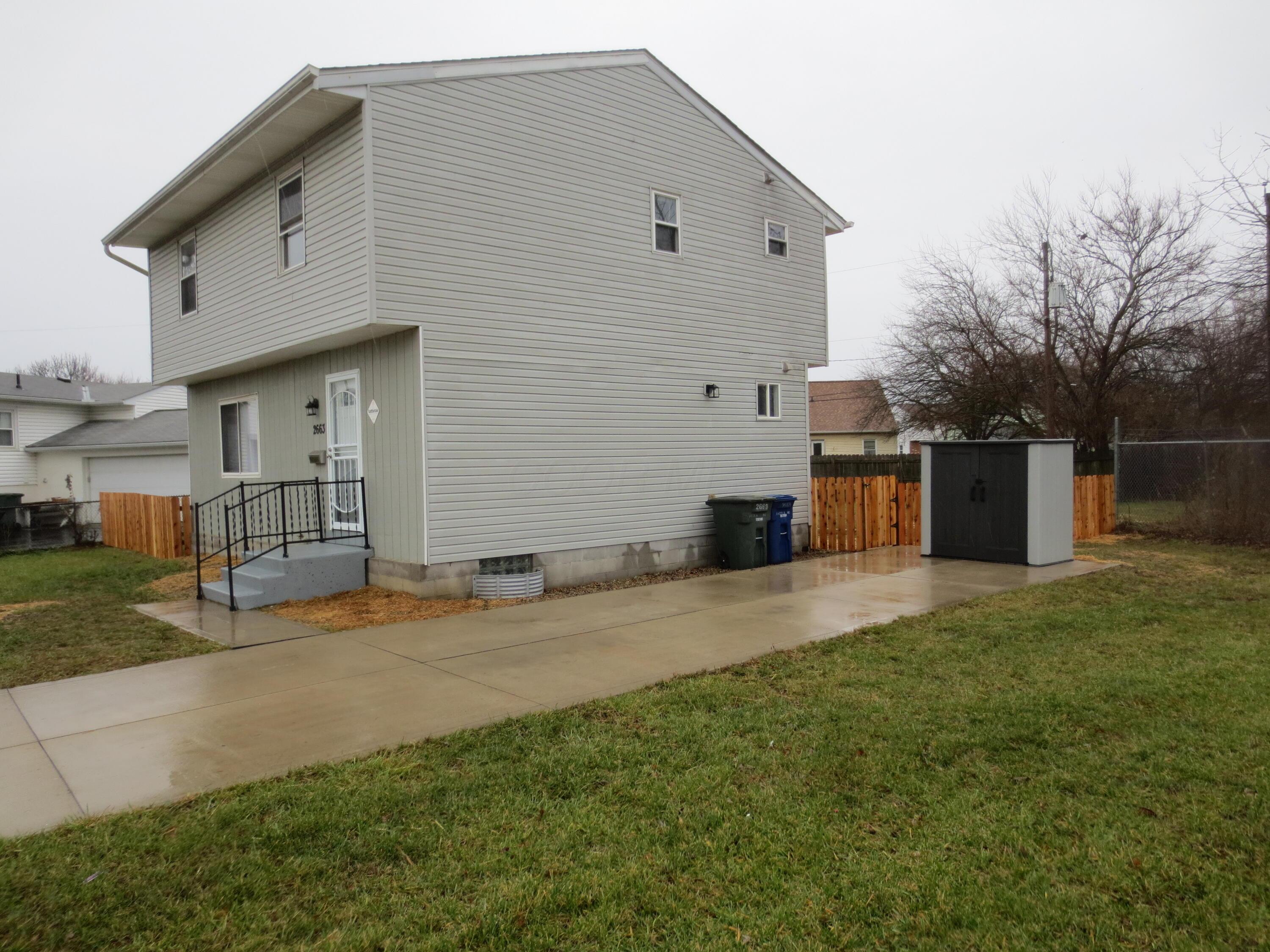 2663 Arcola Road Columbus, OH 43207 - Photo 21 of 21 Side yard and concrete driveway.