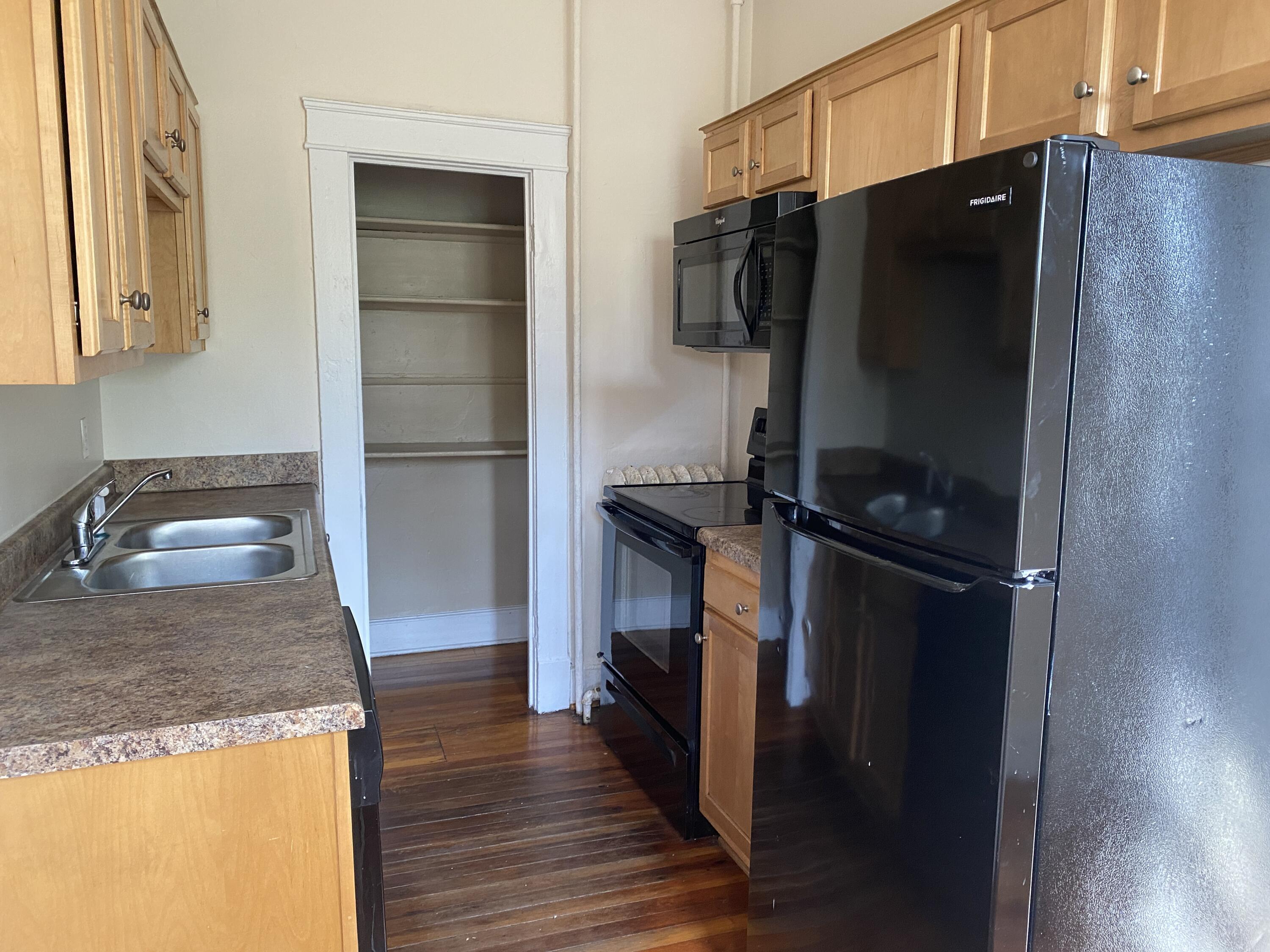 716 4th Street Southwest, Unit 4 Roanoke, VA 24016 - Photo 5 of 10 a kitchen with a refrigerator and a sink