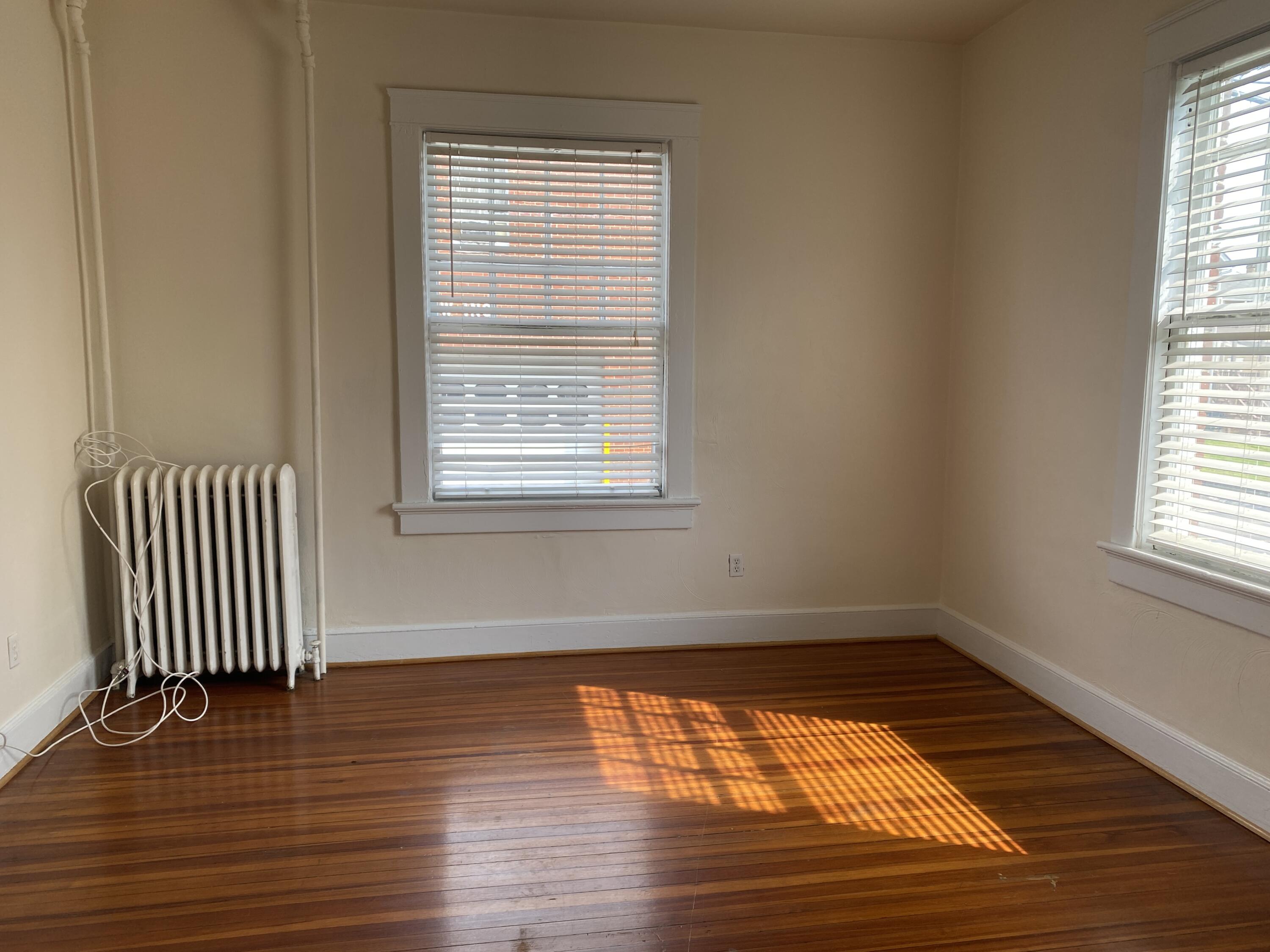 716 4th Street Southwest, Unit 4 Roanoke, VA 24016 - Photo 10 of 10 an empty room with wooden floor and windows