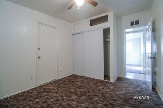 1645 Porter Street Ridgecrest, CA 93555 - Photo 31 of 35 a view of a big room with closet and chandelier fan