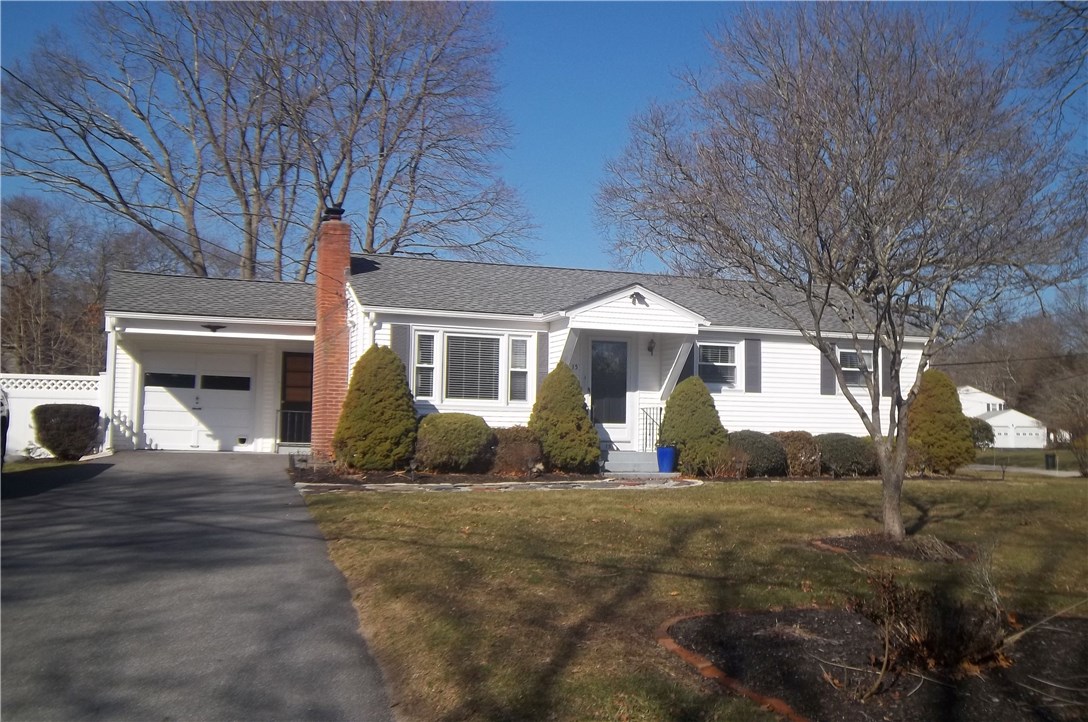 15 Phillips Road East Greenwich, RI 02818 - Photo 1 of 17 Great corner lot, vinyl sided, 1 car garage with covered extension with garage door opener.