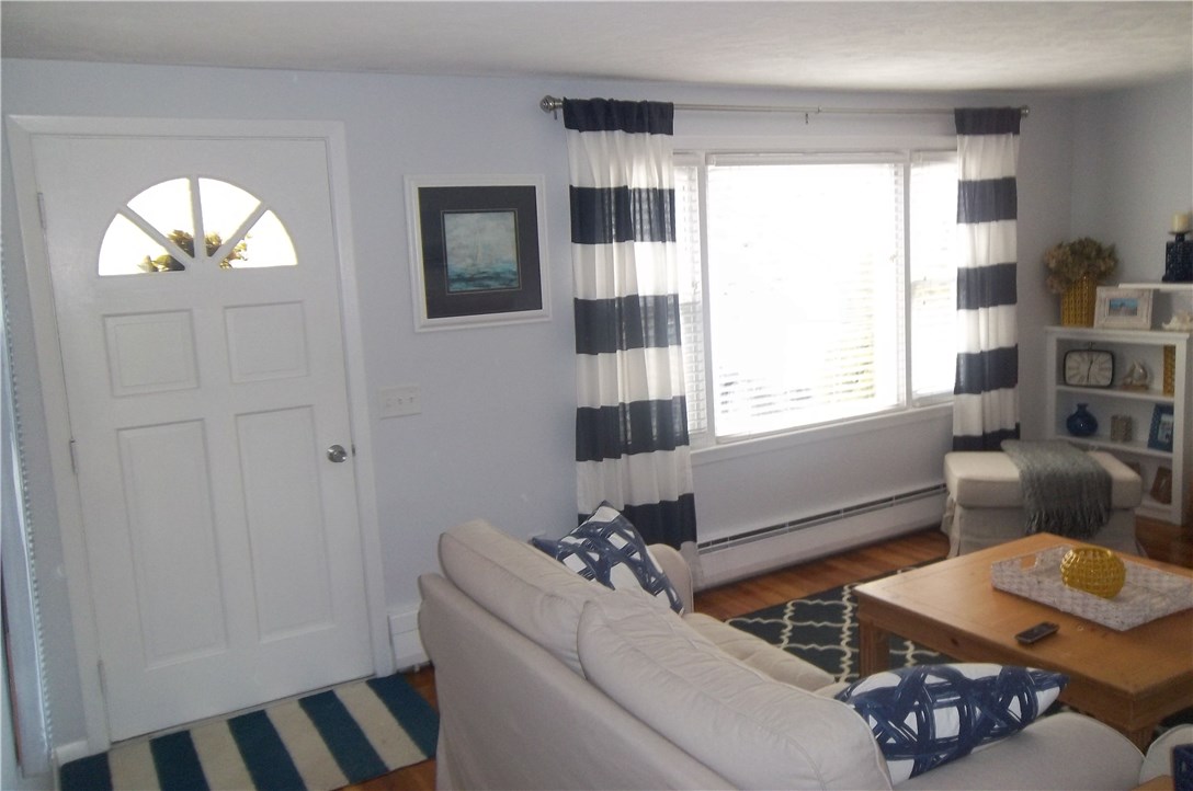15 Phillips Road East Greenwich, RI 02818 - Photo 3 of 17 Living room with large window making this room bright and cheery.