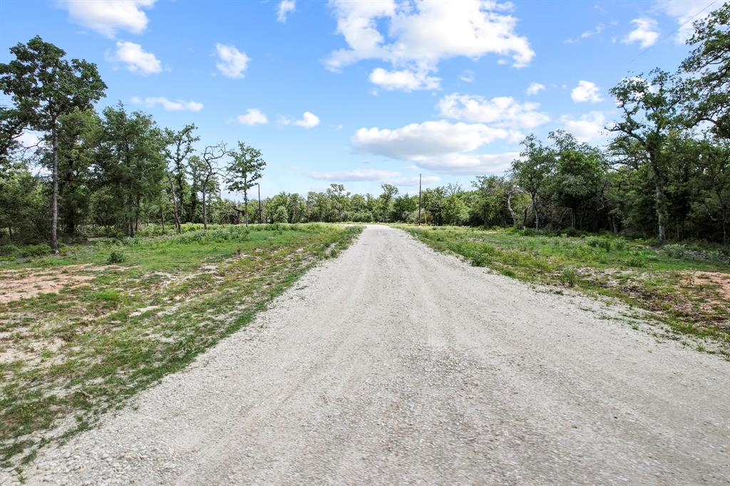 14 The Ranches Rockdale, TX 76567 - Photo 5 of 18 a view of a road with a yard