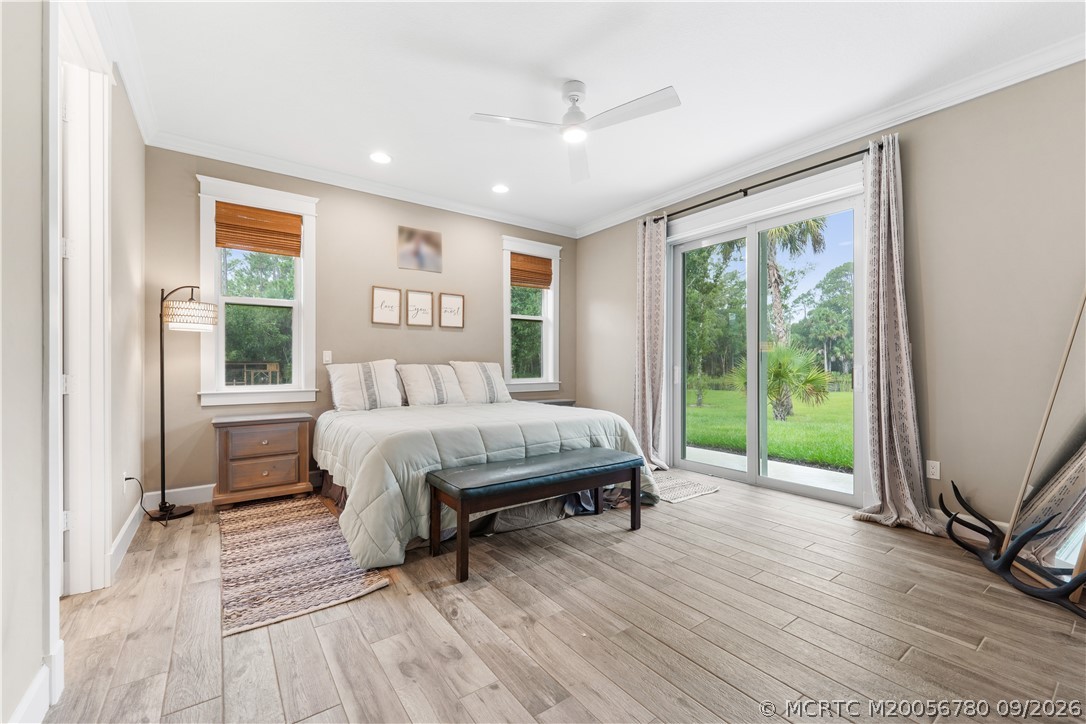 6930 Southwest Rattlesnake Run Palm City, FL 34990 - Photo 17 of 40 Primary bedroom