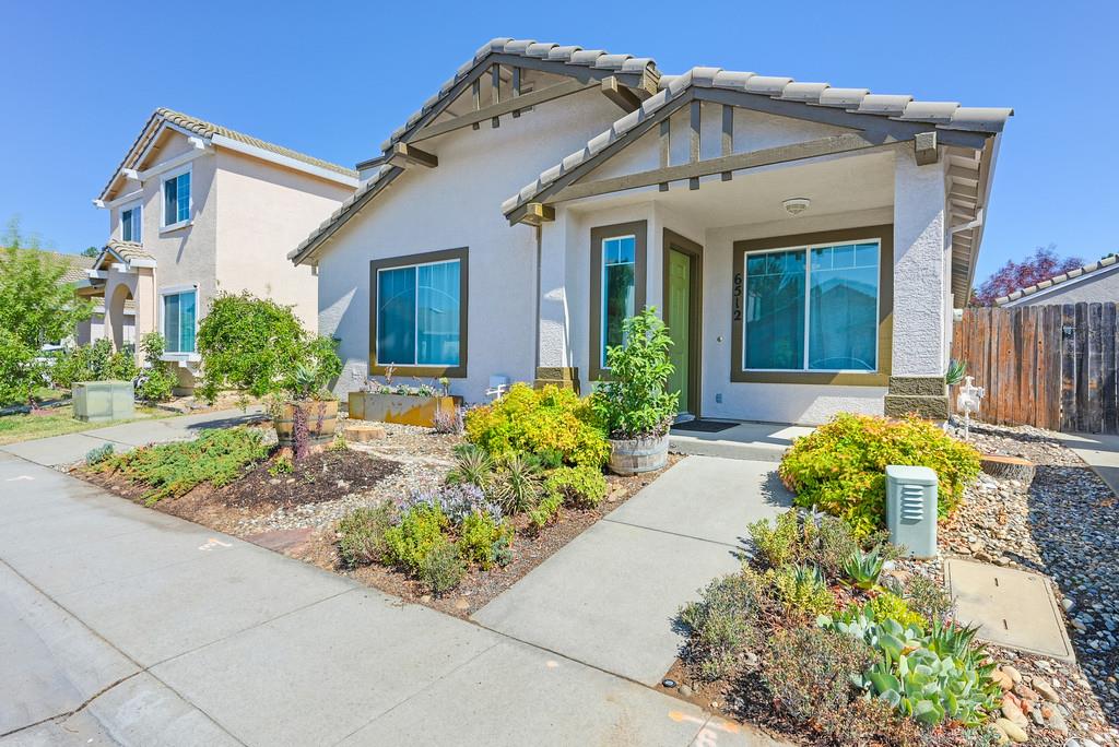 6512 Springridge Way Elk Grove, CA 95758 - Photo 1 of 1 a front view of a house with garden