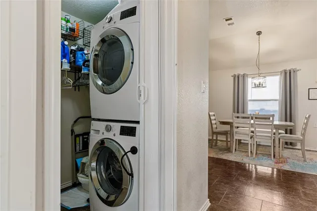 a view of a hallway with washer and dryer