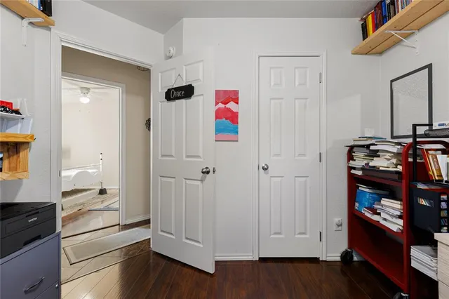 a view of an empty room and wooden floor