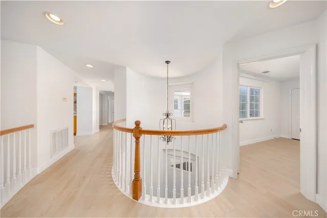 a view of a hallway with seating area