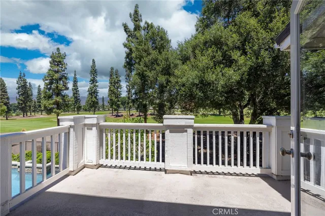 a view of empty room with windows and fireplace