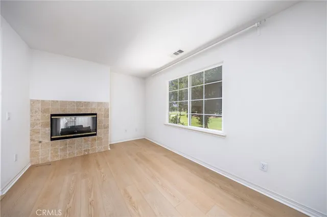 a large bathroom with a large mirror vanity and shower