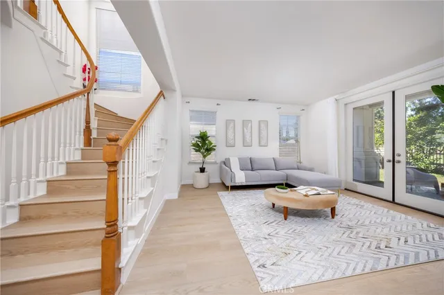 a living room with furniture and a rug
