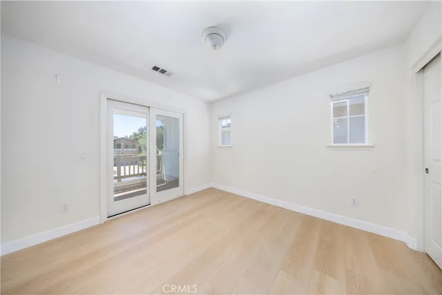 a bathroom with a granite countertop double vanity sink mirror bathtub and shower