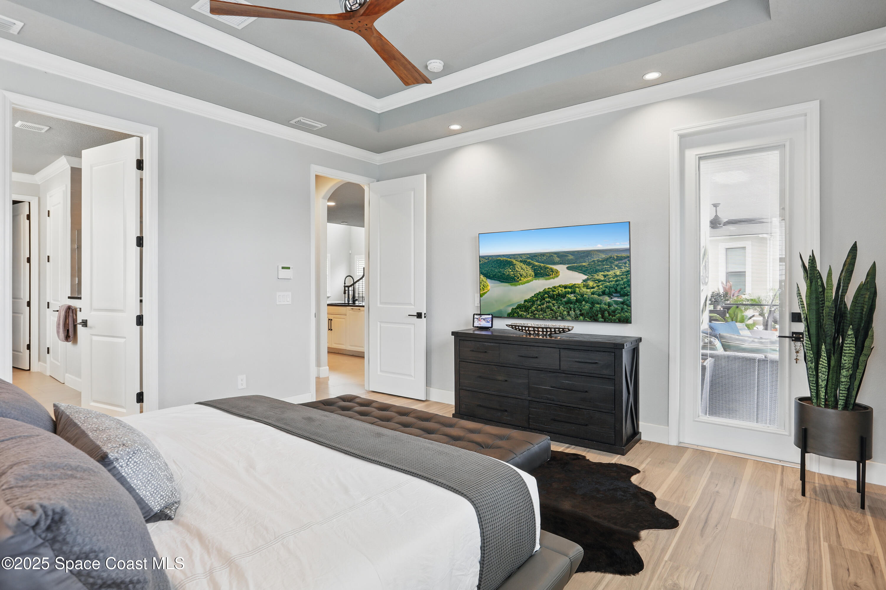 3222 Casterton Drive Melbourne, FL 32940 - Photo 20 of 67 a bedroom with a bed and a potted plant