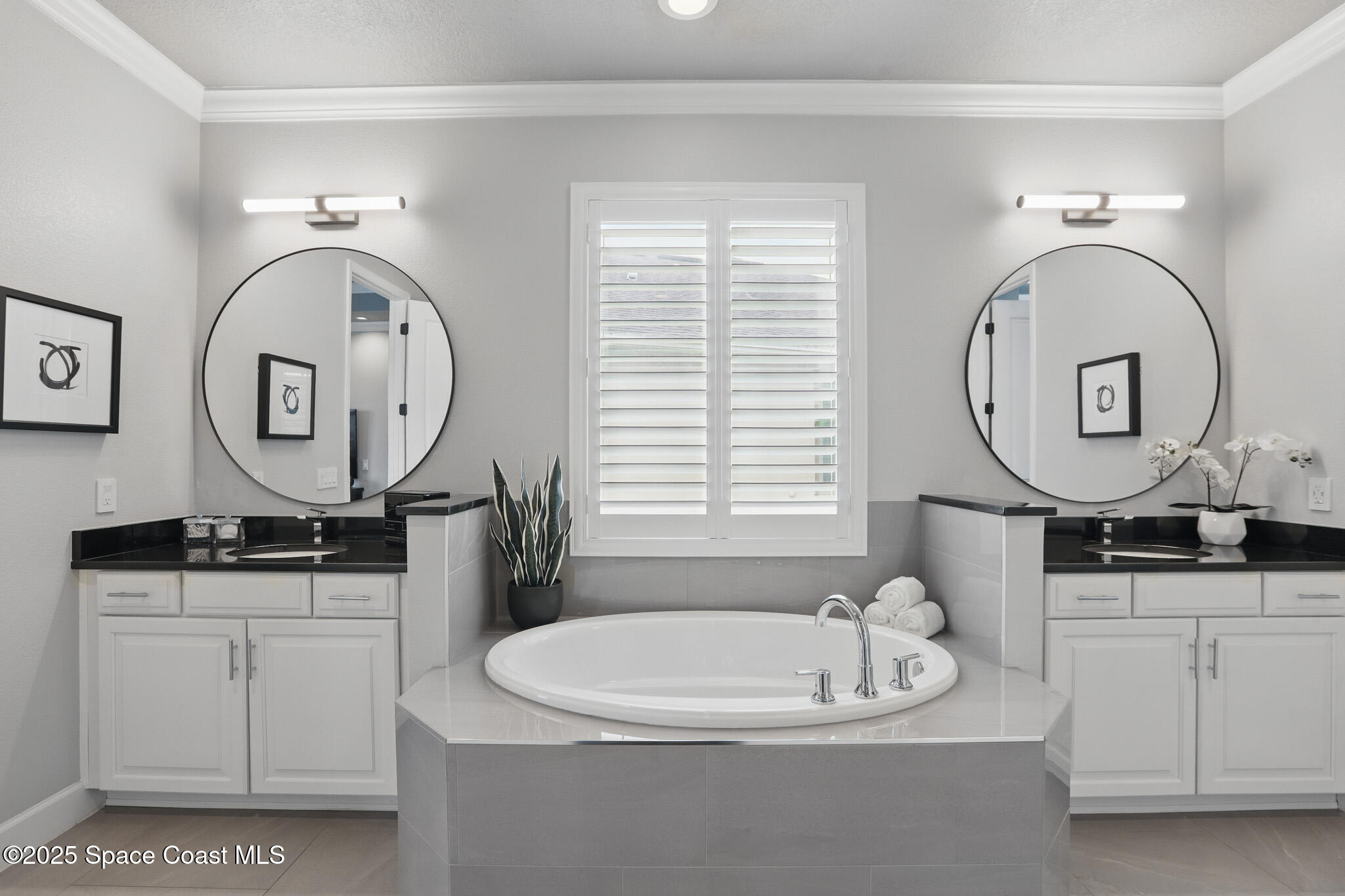 3222 Casterton Drive Melbourne, FL 32940 - Photo 21 of 67 a bathroom with a sink a mirror a vanity and a window