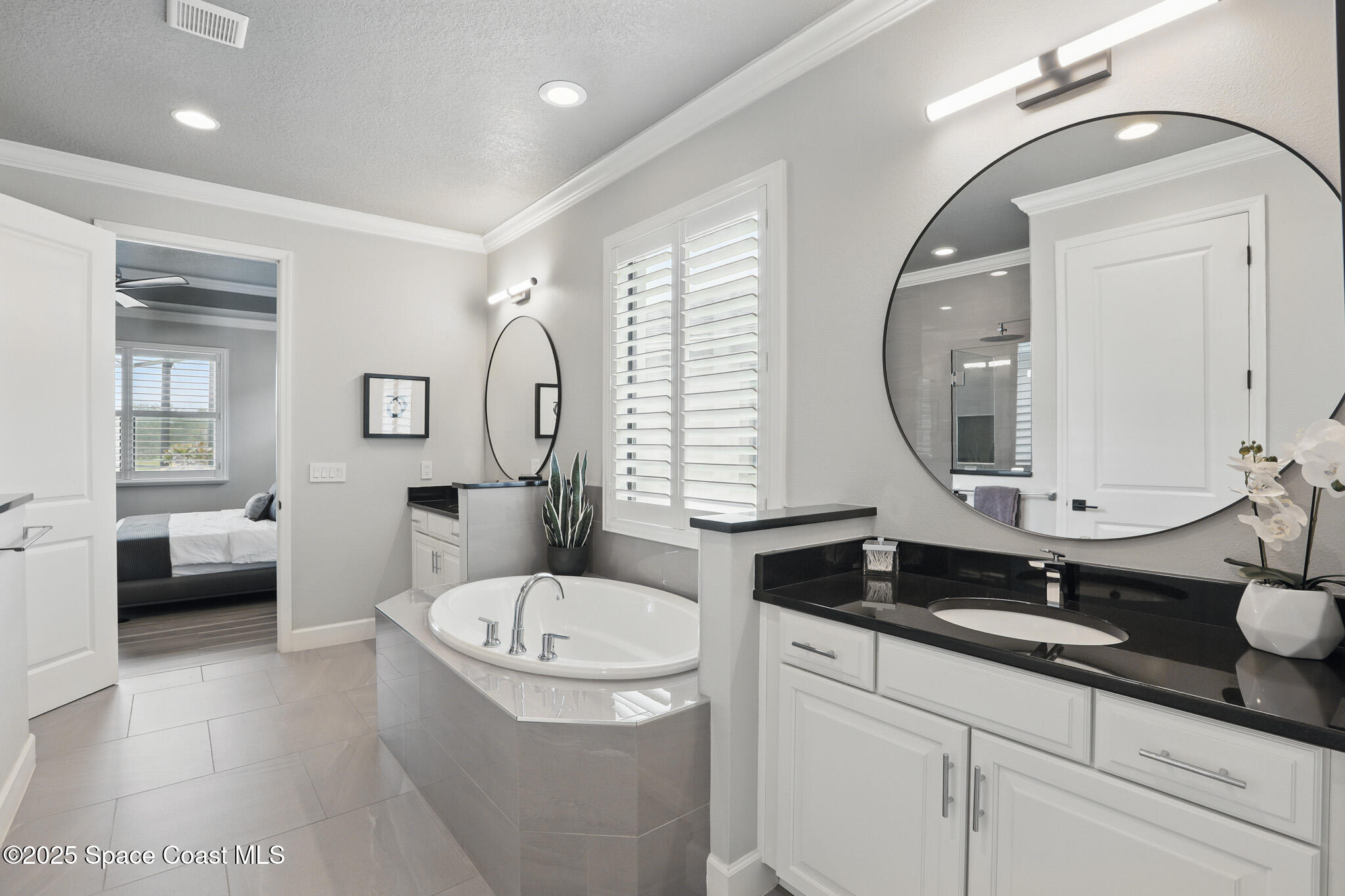 3222 Casterton Drive Melbourne, FL 32940 - Photo 24 of 67 a bathroom with a granite countertop double vanity sink a mirror and a shower