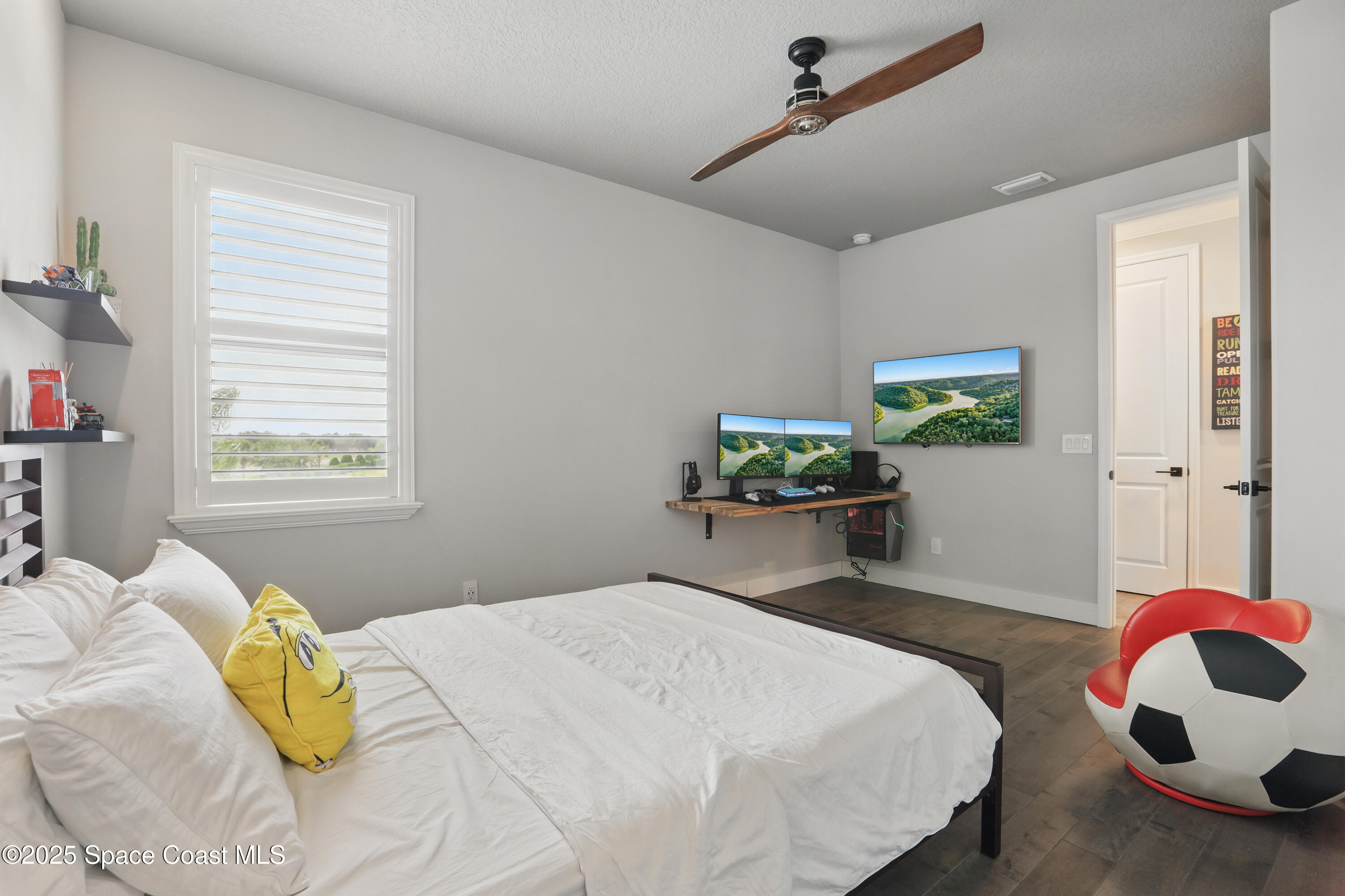 3222 Casterton Drive Melbourne, FL 32940 - Photo 35 of 67 a bedroom with a bed and a window