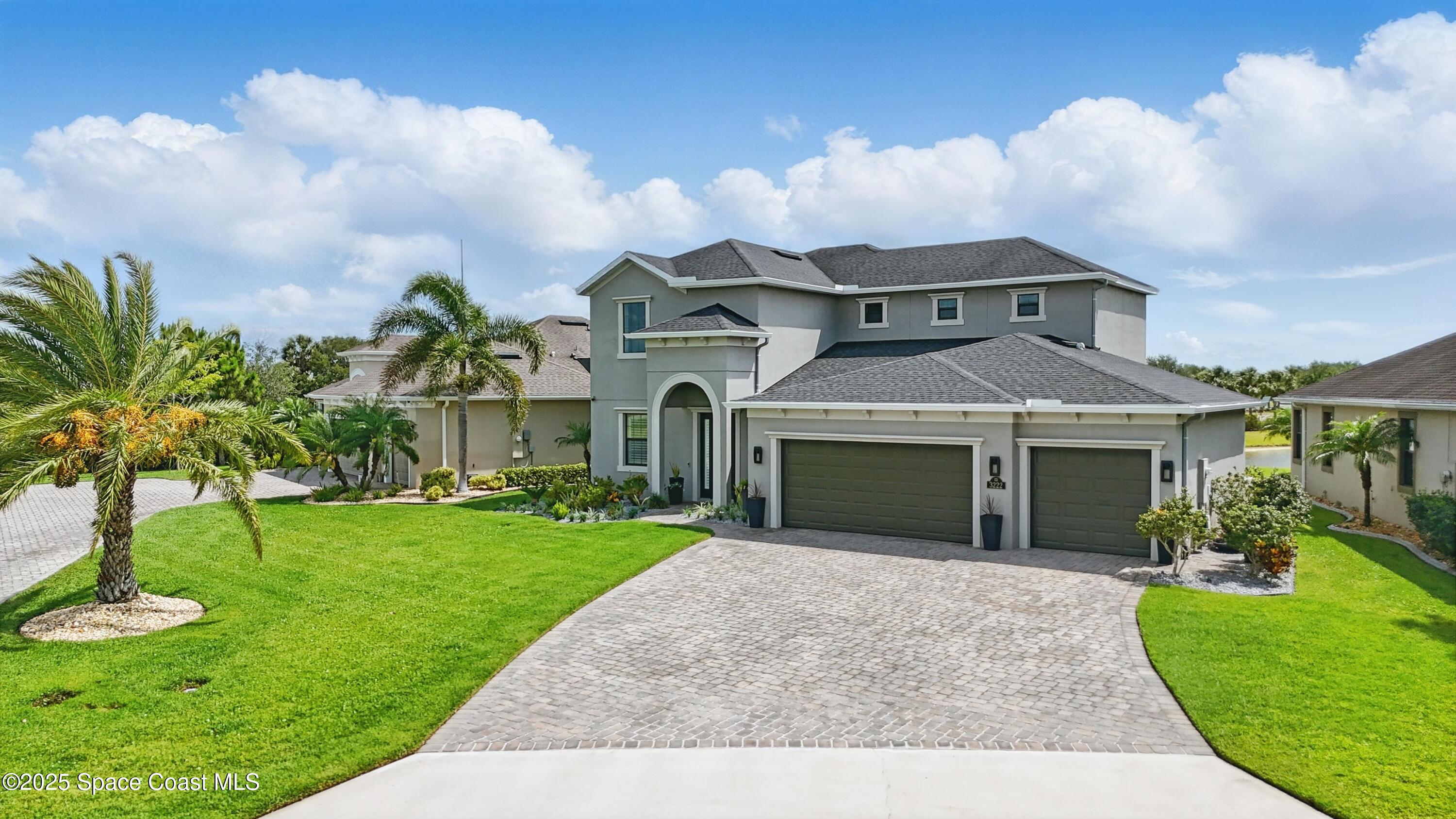 3222 Casterton Drive Melbourne, FL 32940 - Photo 45 of 67 a front view of a house with garden