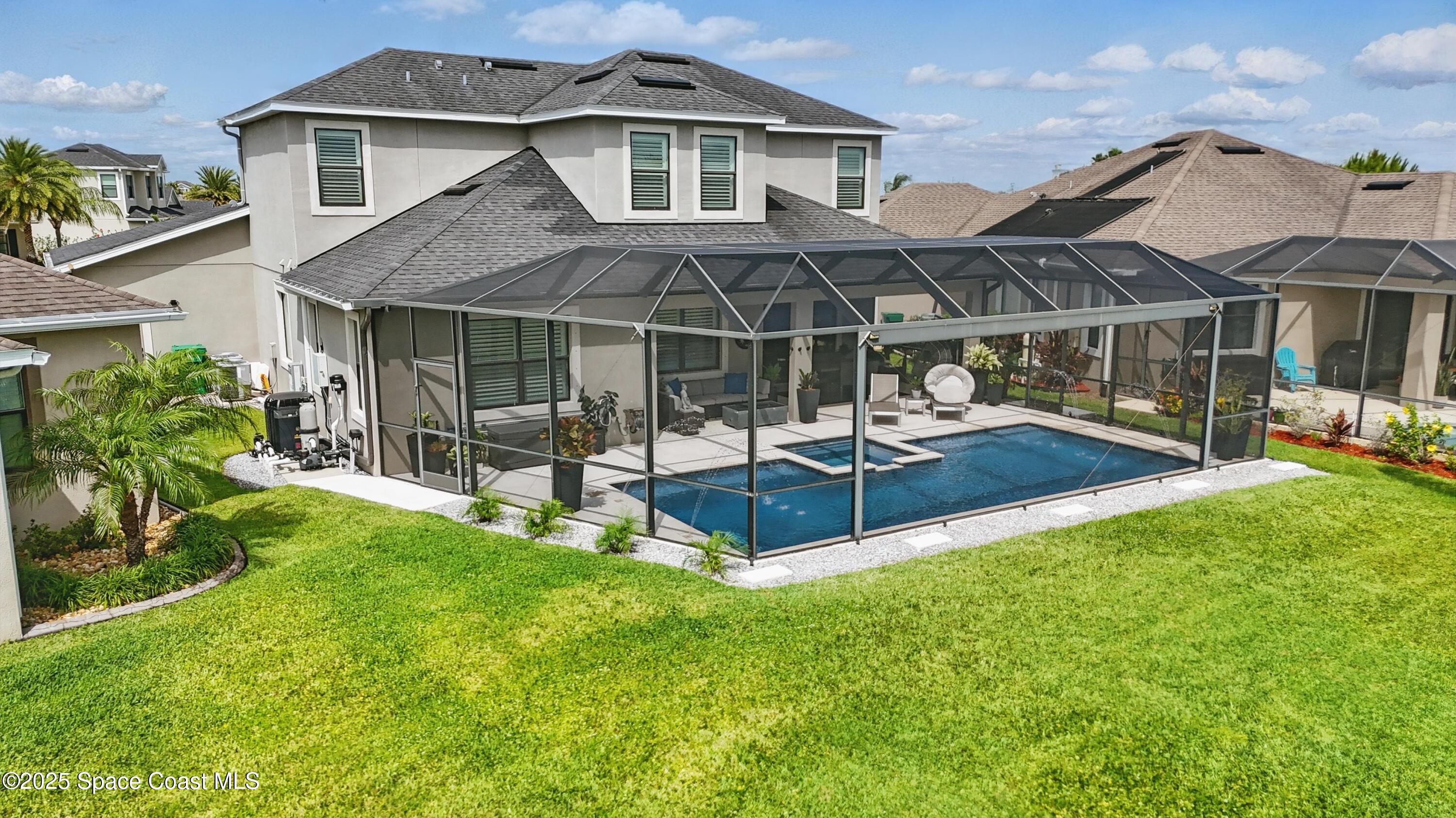3222 Casterton Drive Melbourne, FL 32940 - Photo 49 of 67 a view of a house with a yard patio and slide