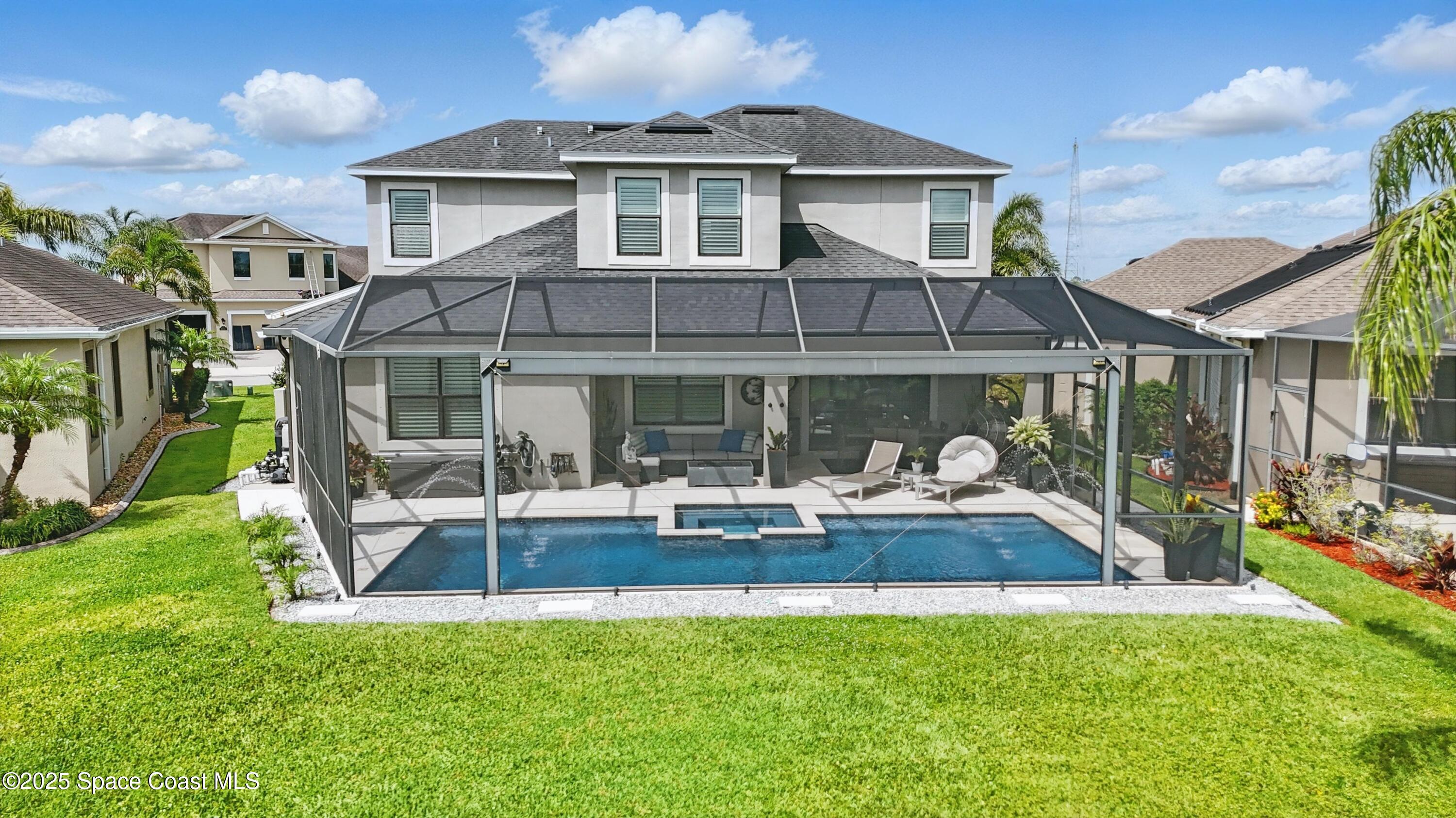 3222 Casterton Drive Melbourne, FL 32940 - Photo 50 of 67 a front view of a house with garden