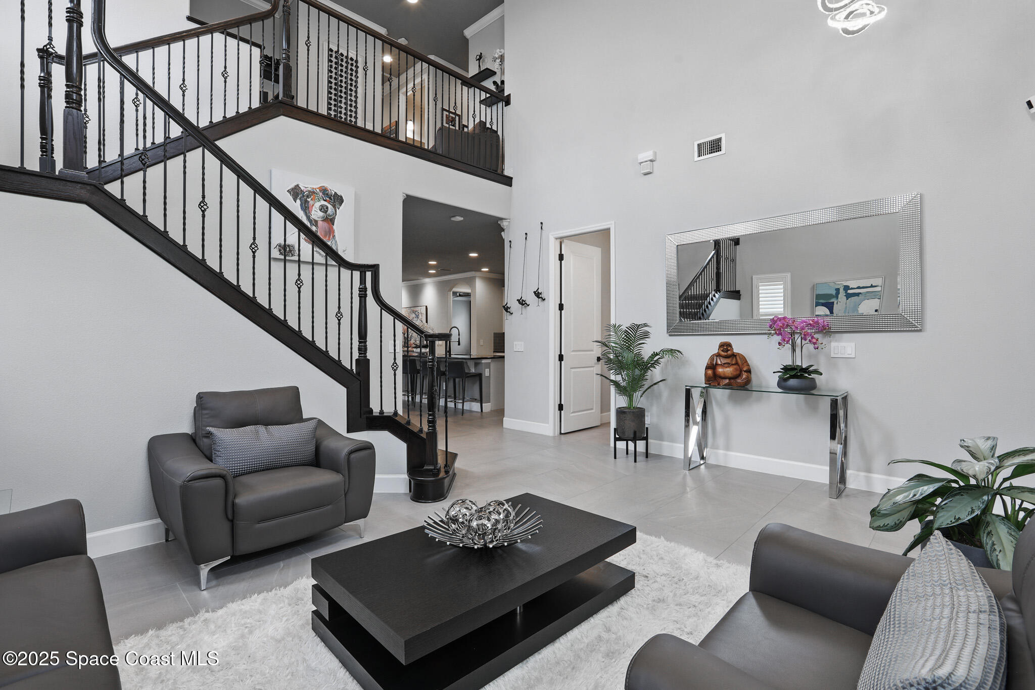 3222 Casterton Drive Melbourne, FL 32940 - Photo 5 of 67 a living room with furniture a rug and a potted plant