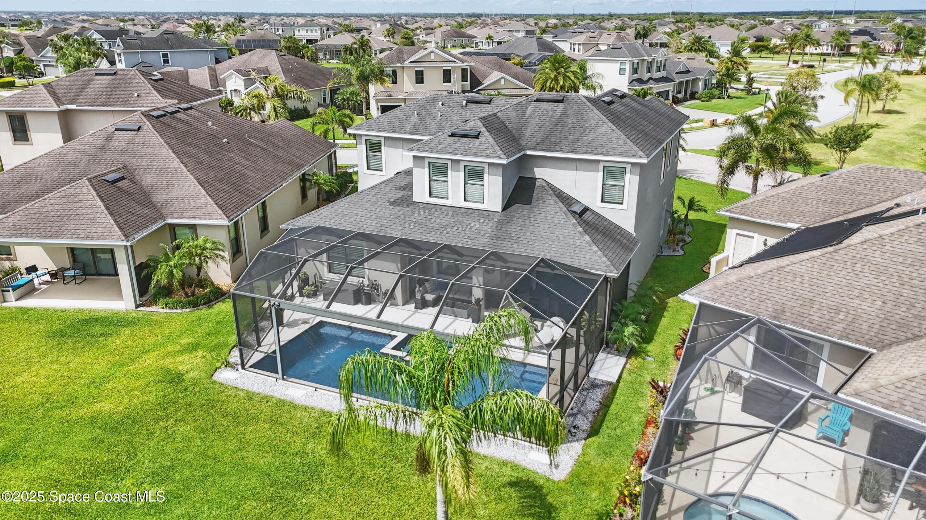 3222 Casterton Drive Melbourne, FL 32940 - Photo 51 of 67 an aerial view of residential houses with outdoor space and trees