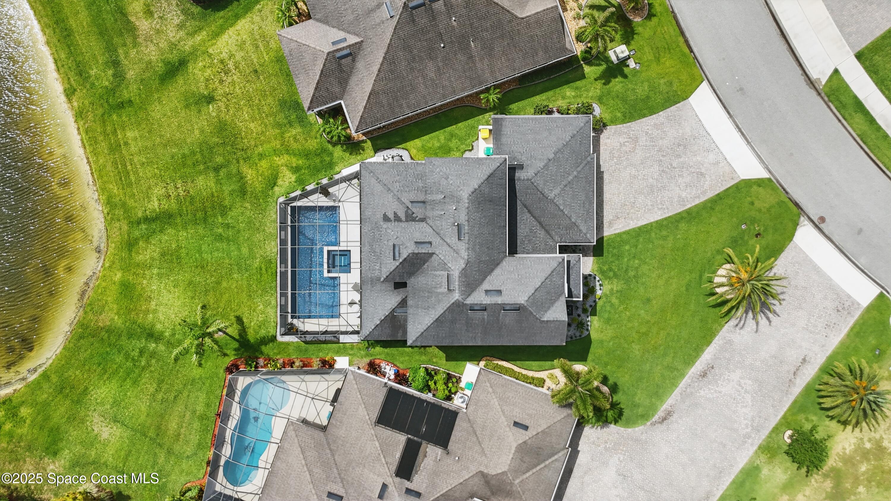 3222 Casterton Drive Melbourne, FL 32940 - Photo 52 of 67 an aerial view of a house with a garden