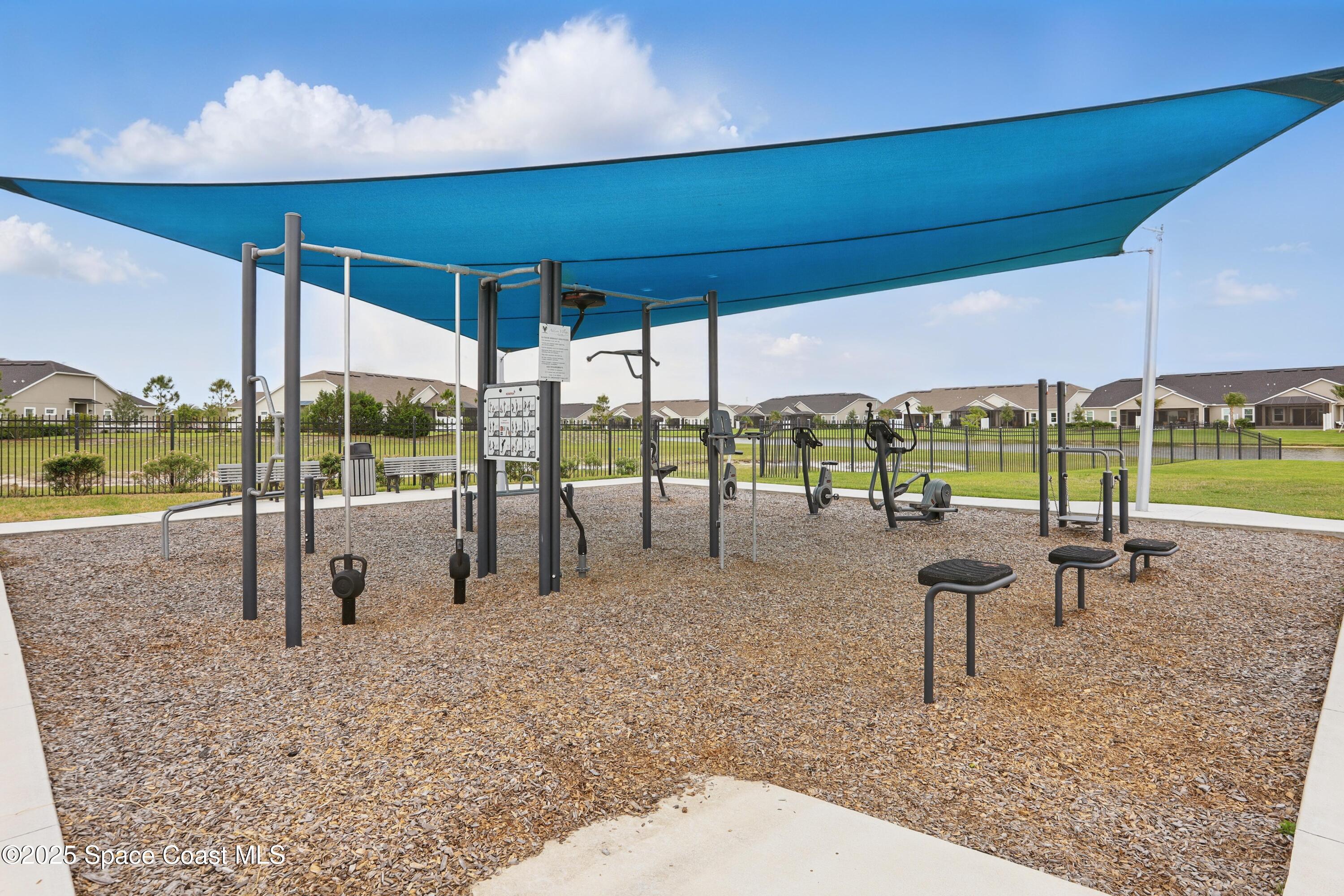 3222 Casterton Drive Melbourne, FL 32940 - Photo 56 of 67 a swimming pool with a yard and outdoor seating