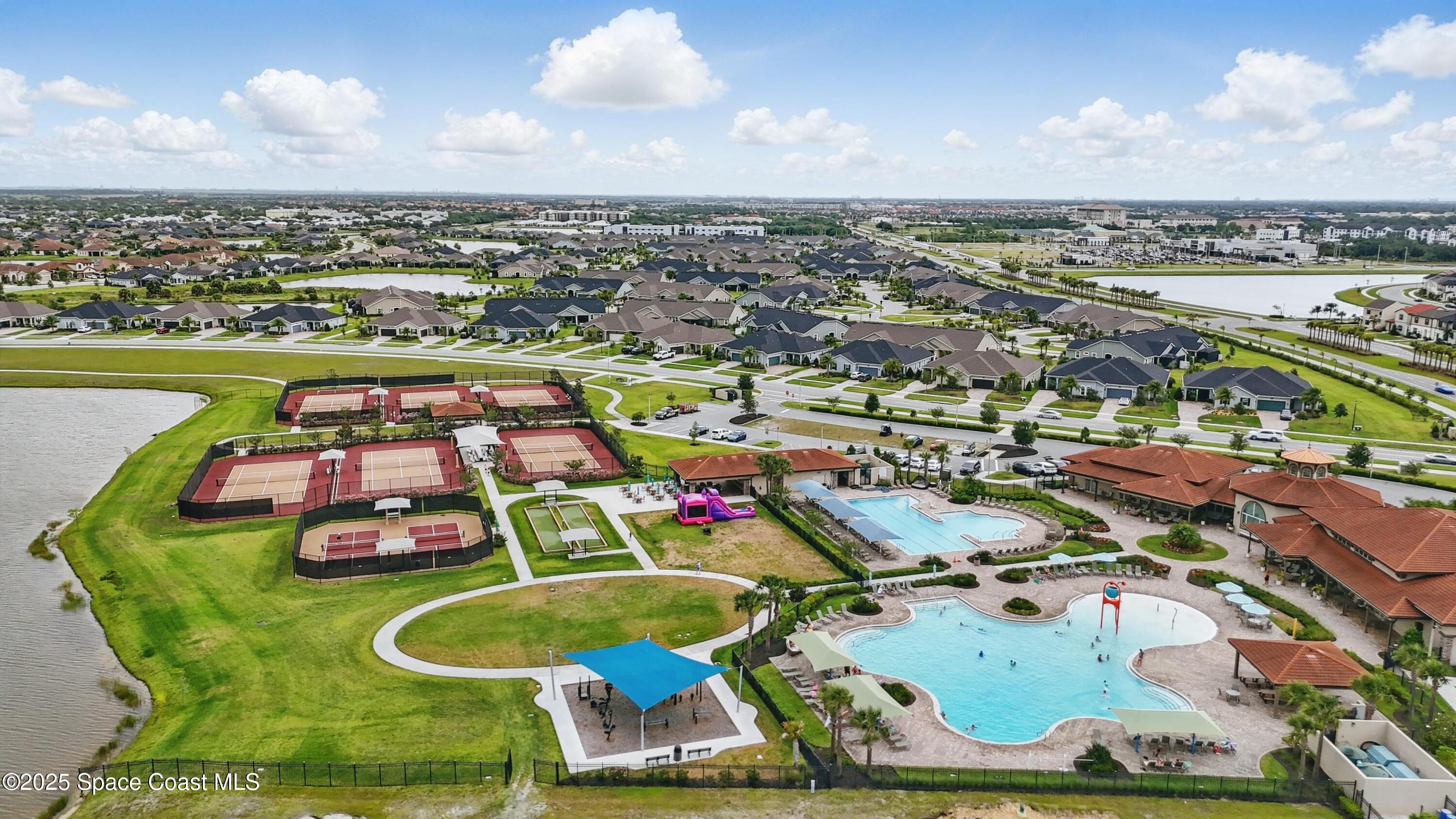 3222 Casterton Drive Melbourne, FL 32940 - Photo 60 of 67 a aerial view of a pool yard and mountain view in back