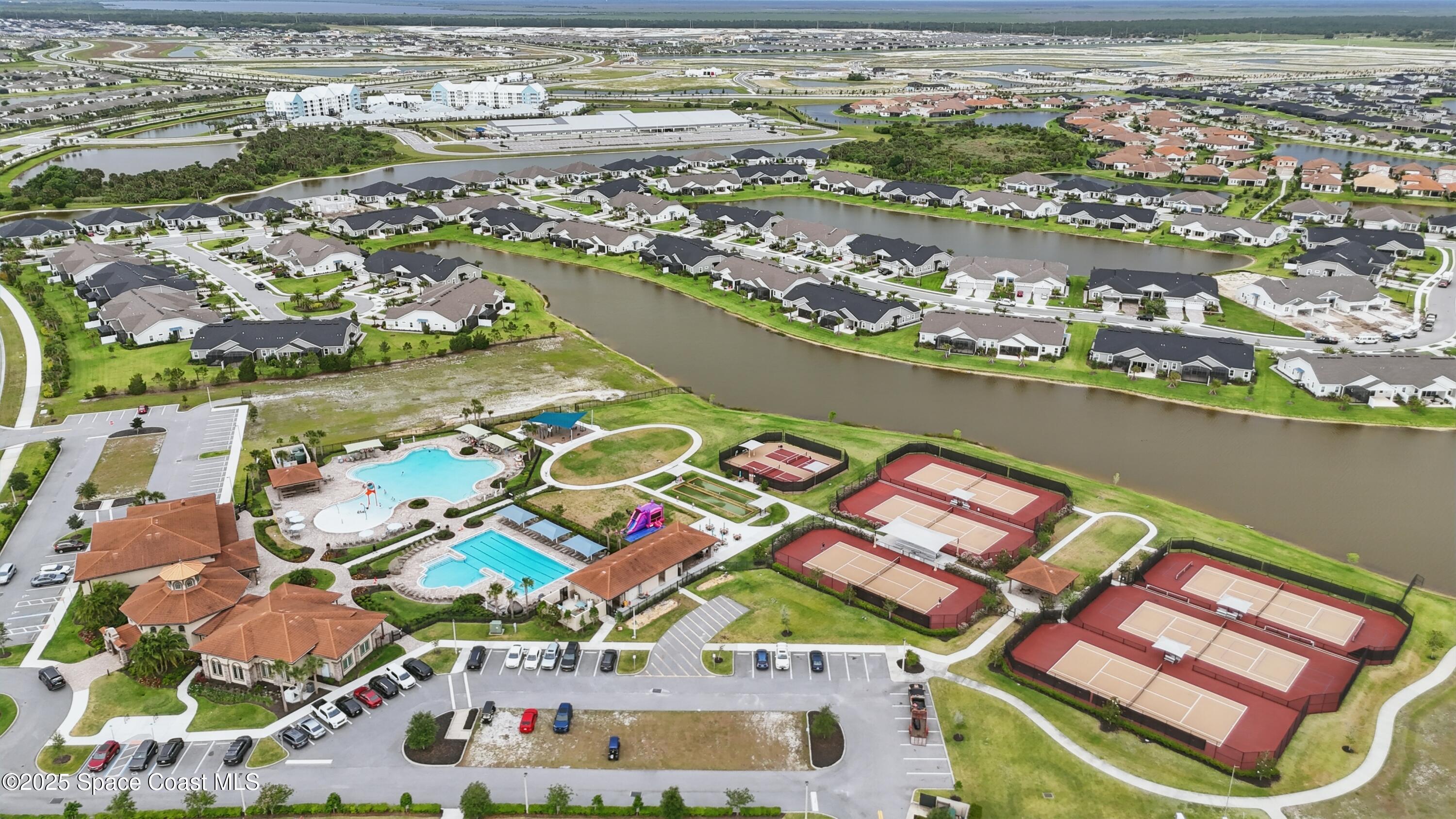 3222 Casterton Drive Melbourne, FL 32940 - Photo 63 of 67 an aerial view of residential houses with outdoor space