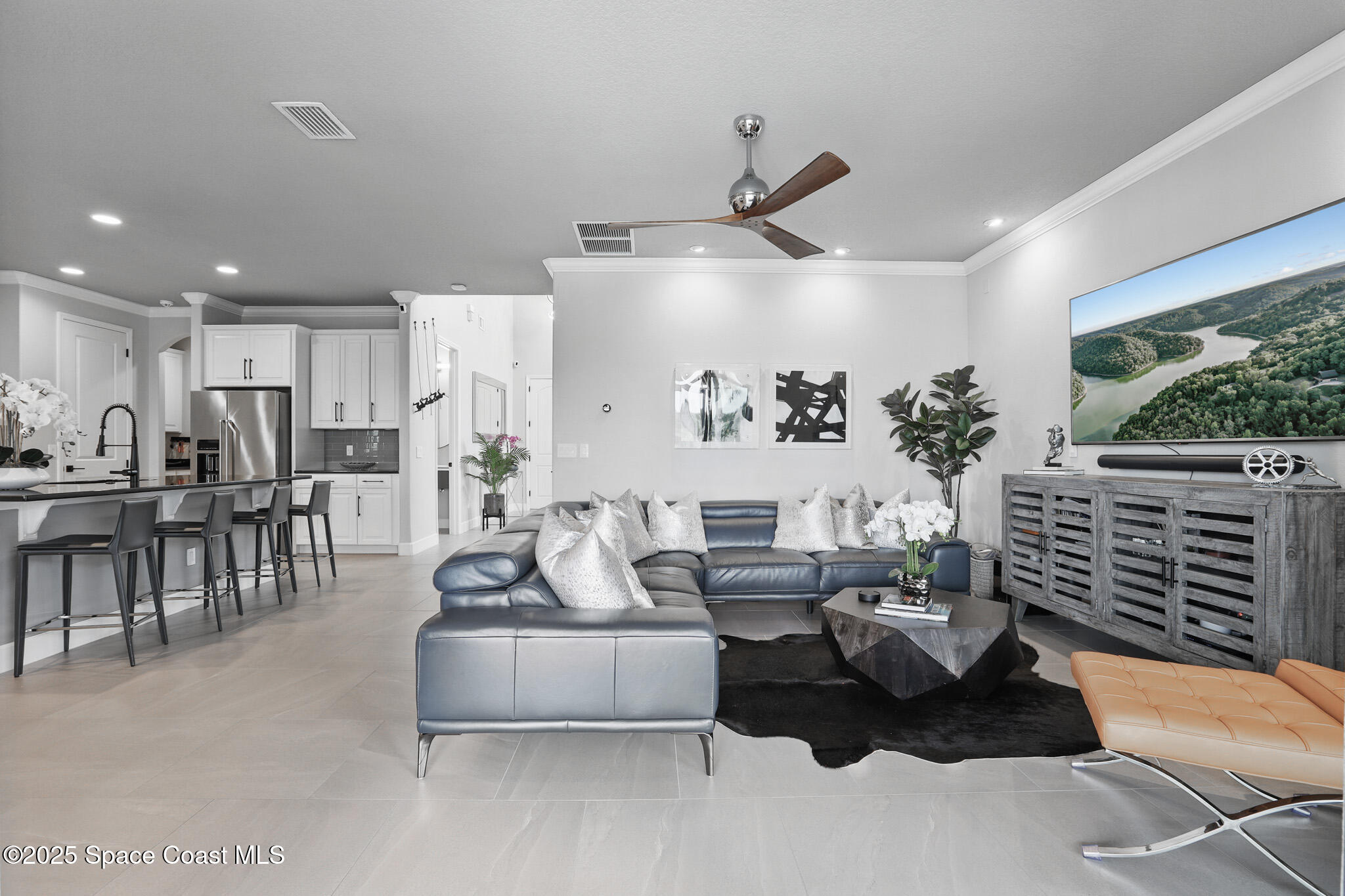3222 Casterton Drive Melbourne, FL 32940 - Photo 9 of 67 a living room with furniture and a large window