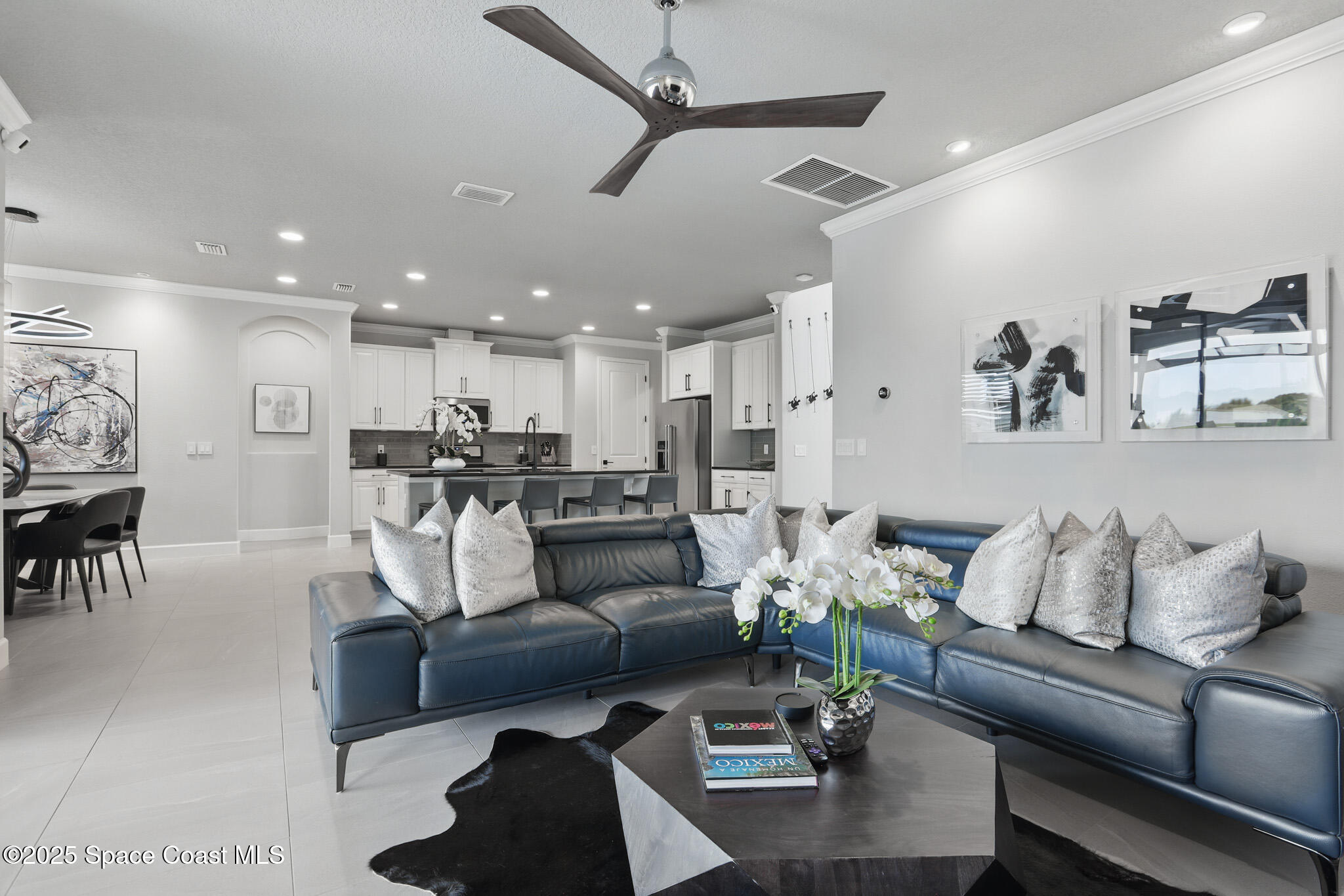 3222 Casterton Drive Melbourne, FL 32940 - Photo 10 of 67 a living room with furniture kitchen view and a chandelier