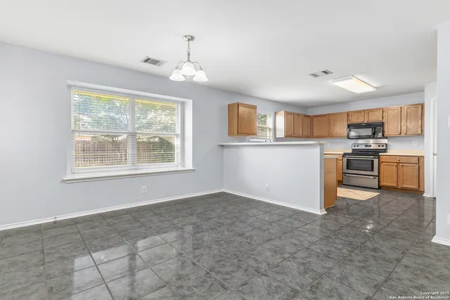 a view of kitchen with window and furniture