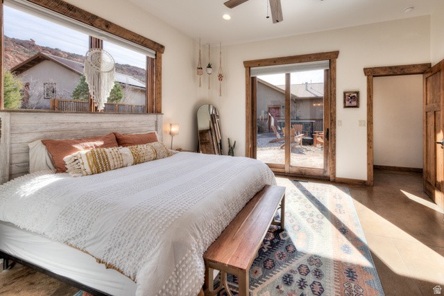 4173 Shadowfax Run, Unit 5 Moab, UT 84532 - Photo 30 of 41 Bedroom featuring access to courtyard and large windows