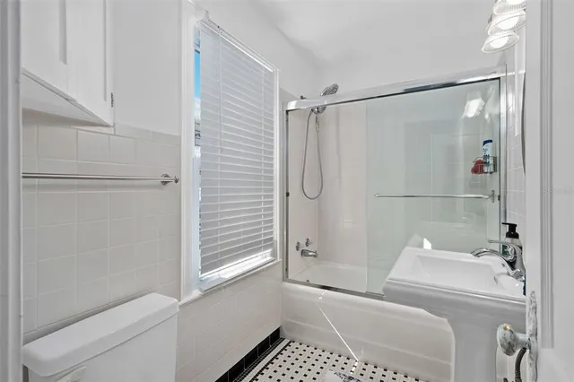 a bathroom with a shower and a tub
