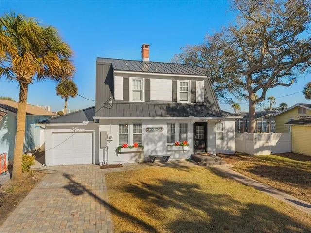 a view of a lake with table and chairs