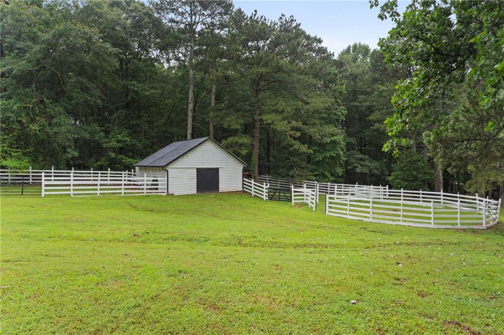 2827 Highway 138 Conyers, GA 30013 - Photo 11 of 32 a swimming pool with wooden fence
