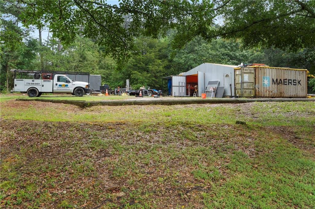 2827 Highway 138 Conyers, GA 30013 - Photo 12 of 32 a front view of a house with garden
