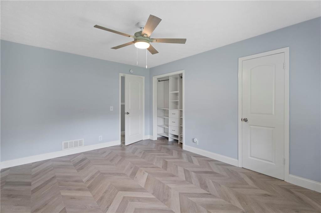 2827 Highway 138 Conyers, GA 30013 - Photo 16 of 32 a view of an empty room with a ceiling fan