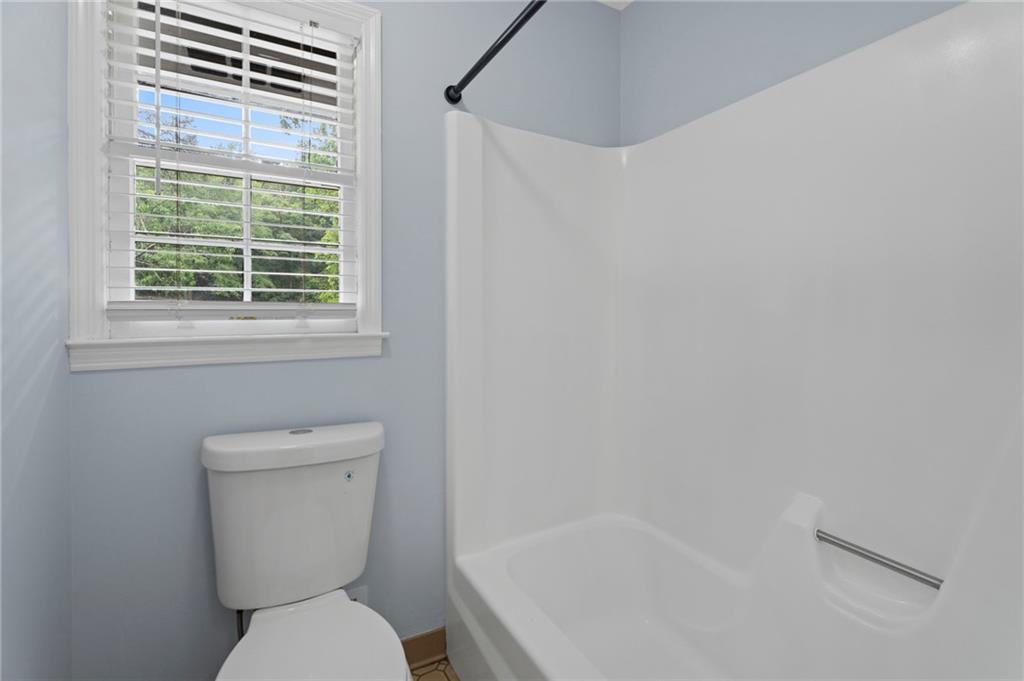 2827 Highway 138 Conyers, GA 30013 - Photo 25 of 32 a white toilet sitting next to a window