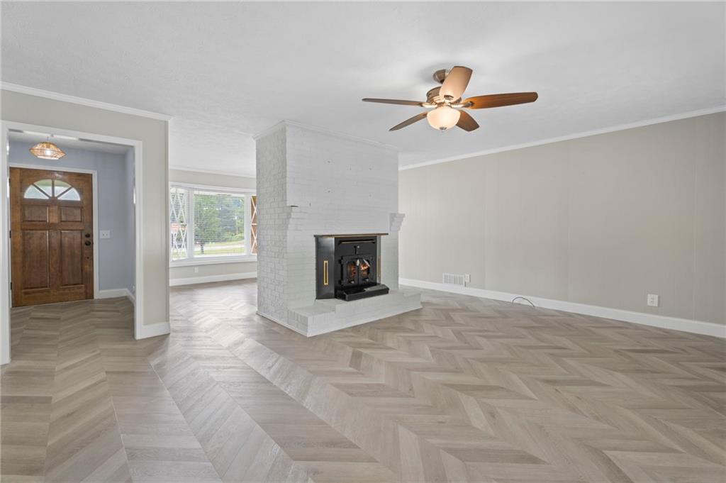 2827 Highway 138 Conyers, GA 30013 - Photo 28 of 32 a view of a livingroom with a fireplace and window