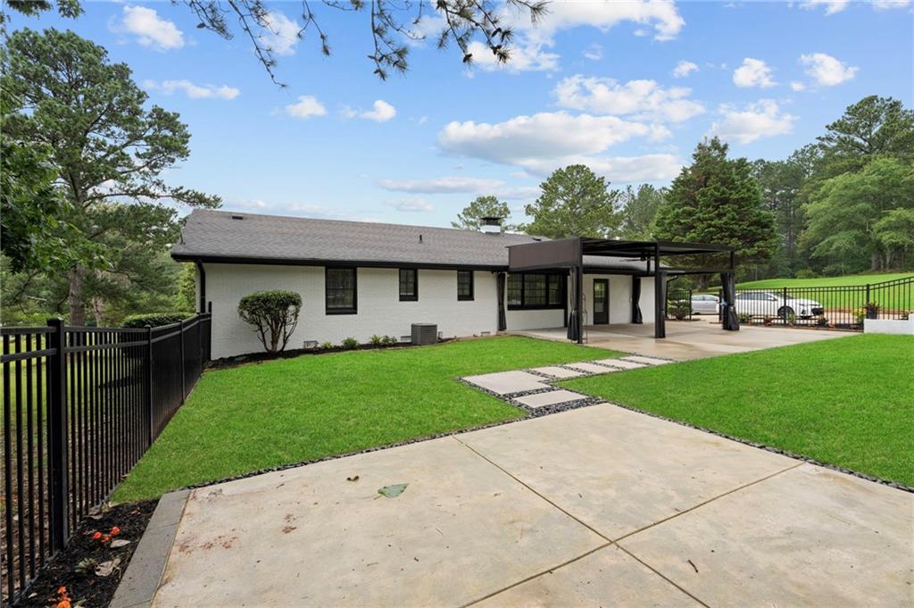 2827 Highway 138 Conyers, GA 30013 - Photo 10 of 32 a view of a house with a yard